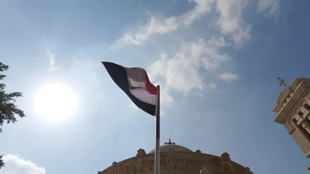 View of the Egyptian flag in front of the Catholic church in the oldest part of Cairo