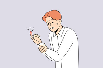 Unhappy man suffer from finger trauma. Unwell guy look at red bruised hand. Hand damage concept. Vector illustration. 