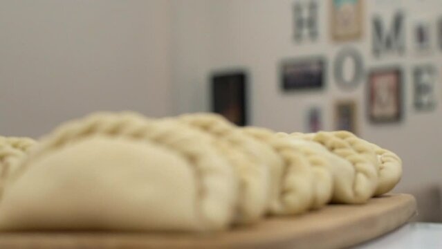 Showing empanadas 2 (Focus - B Roll)
