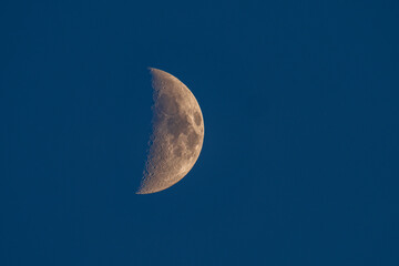 Obraz na płótnie Canvas The growing moon or crescent moon in the blue sky.