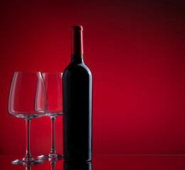 Red wine glasses and bottle