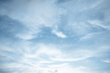 White clouds in the blue sky. Background.