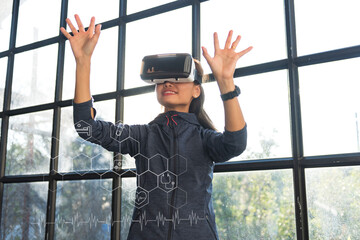 Medical technology concept mixed media female doctor wearing virtual reality glasses check brain test results with simulated interface, innovative scientific and medical technology.