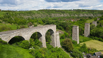 Fototapeta na wymiar View from a height of the old aqueduct near the city of Kamenetz-Podolsk 