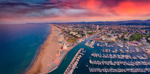 Panoramic summer view from flying drone of Libera Rimini public beach. Incredible evening scene of...
