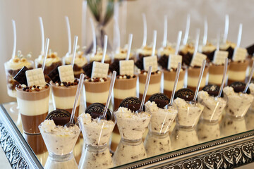 Festive sweet table. Cakes, cookies, fruits and mousses. Buffet table
