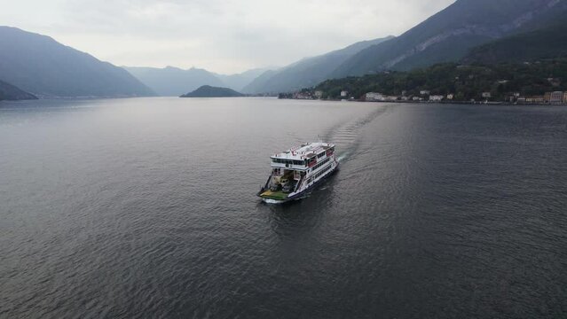 Pontoon Ferry Boat Transporting Cars across Lake Como Water in Italy, Aerial Drone