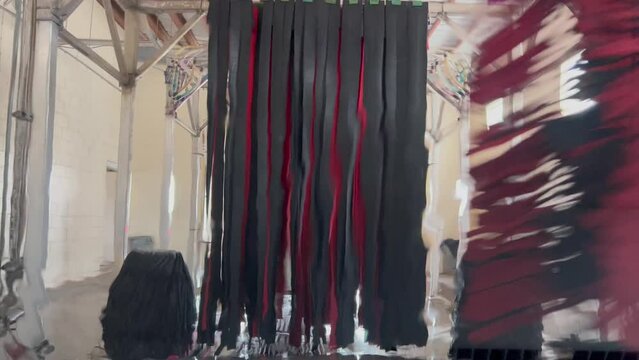 4k Car driving through car wash with brushes and soap through front window b roll
