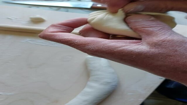 Traditional Buryad Buuz making process. Steamed dumpling filled with meat