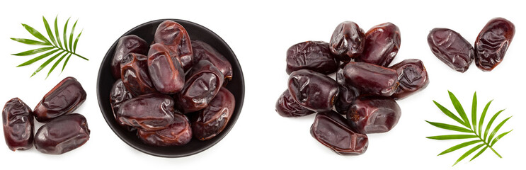 date fruits with green leaves isolated on white background. clipping path. top view