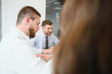 Fototapeta premium Group of young people in business meeting