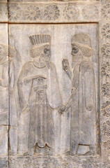 Ancient wall with bas-relief with assyrian foreign ambassadors with gifts and donations,...