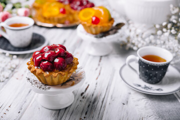 delicious cake with cherries and tea