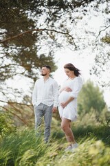 Portrait of lovely future parents during sunset