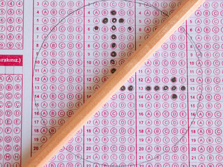 optical pink form of an examination with pencil, close up, time's up concept, idea, noise effect,