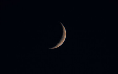 Obraz na płótnie Canvas a close-up of a waning crescent moon