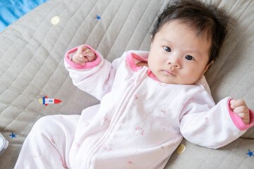 Asian newborn baby kid eye contact with mom cuteness of children with happy family on soft mattress metaphor living life healthy lifestyle cute of kid baby products health products for mother and baby