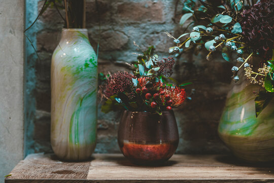 Flower vases on table in cafe