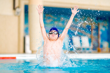 Boy in the swimming pool.  Training sessions on the water.
