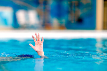 The child is drowning in the swimming pool.  Danger The child is drowning in the swimming pool.  Danger