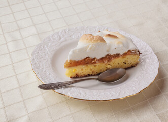 Piece of homemade cake with  meringue