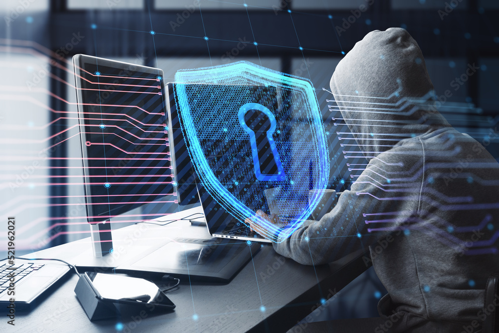 Poster Side view of hacker at desktop using computers with creative glowing shield circuit security hologram on blurry office interior background. Safety and web protection concept. Double exposure.