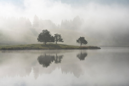 Germany, Bavaria, Lake Schmalensee shrouded in thick autumn fog