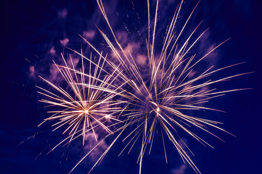Colorful fireworks in the night sky. Festive pyrotechnic show. Background image.
