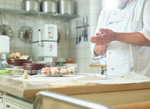 Confectioner preparing marzipan at kitchen