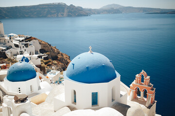 blue domes of greece with blue sea sky white buildings in santorini island village oia 