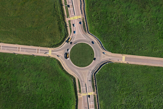 Aerial view of traffic circle on sunny day