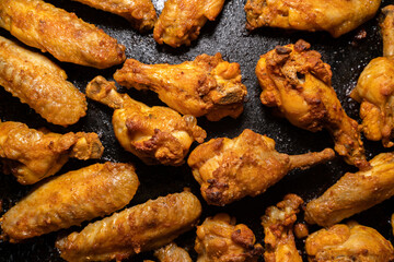Crispy grilled chicken wings on a baking tray