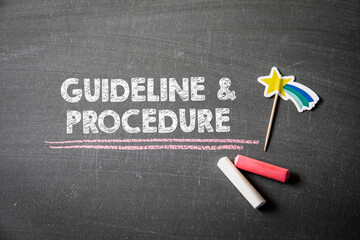 Guideline and Procedure concept. Text on a dark chalk board