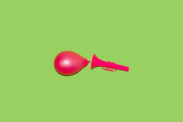 a trumpet from which a balloon dropped creative art design, minimal concept
