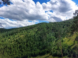 Scenic view of mountains, forests and valleys from mountain peak