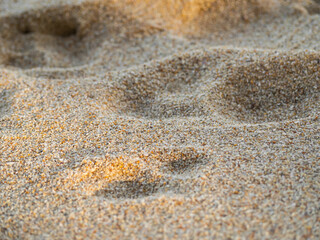 Sand background.brown yellow granula desert beach sea natural at coast.photography texture pattern grain material sandy ocean wallpaper top view.for tourism vacation tropical summer holidays concept.