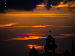 Ramadan, Eid ai-fitr,New year Muharram islamic religion Symbols with Mosques Dome silhouette with Crescent moon on dark black and twilight sky in night sunset. arabic,Eid al-adha,mubarak  Muslim.