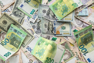 100 european money, 100 dollar and 1000 ukrainian hryvnia uah exchange concept, finance background.