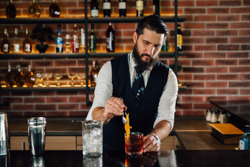 close up of barman preparing cocktail in nightclub