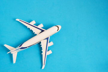 Airplane model blue background.Concept travel and recreation.