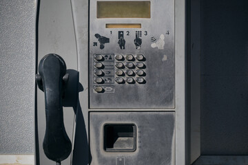 Old street, public push-button payphone.Retro technology.