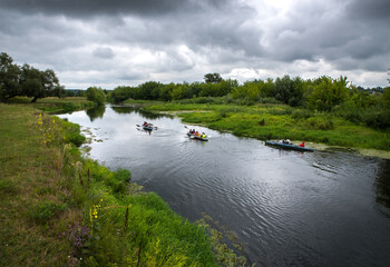 Kayaks with tourists on a clean, untouched by civilization river of Volyn Polissya.