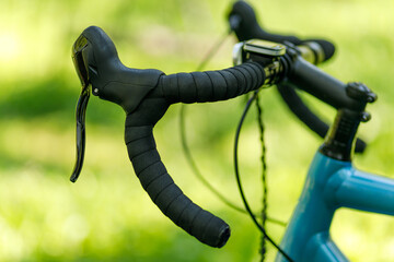 Gravel bike handlebar with winding, brake levers and shifter.