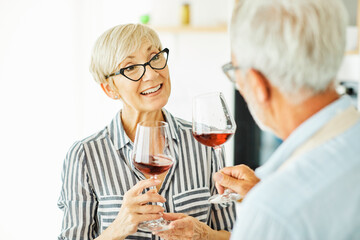 love kitchen senior glass woman couple home retirement happy food smiling husband wine together portrait