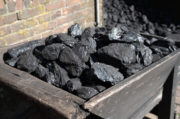 Old-fashioned, non-environmental heating fuel, black rock coal for use in stoking area, air pollution