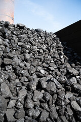 Old-fashioned, non-environmental heating fuel, black rock coal for use in stoking area, air pollution