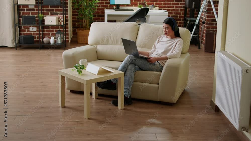 Poster happy smiling heartily person attending online conference on laptop while doing remote work at home.