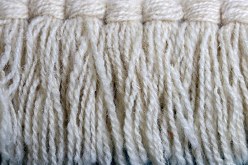 Snow white wool yarn cloth background. Surface of fabric texture in white winter color.