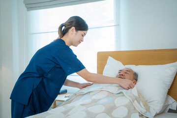 Nurses take care in patient bed in home bed in home,Home care service.