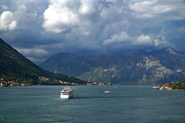 The entrance to the Bay of Kotor, Montenegro with dramatic storm clouds gathering over the mountains